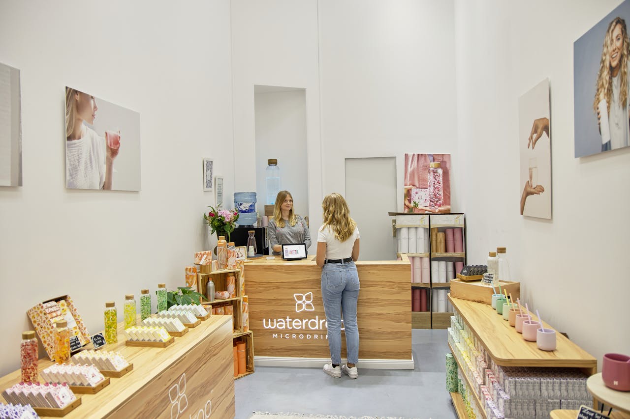 Aquatic-themed store interior with vibrant products and a customer at the counter, Berlin.